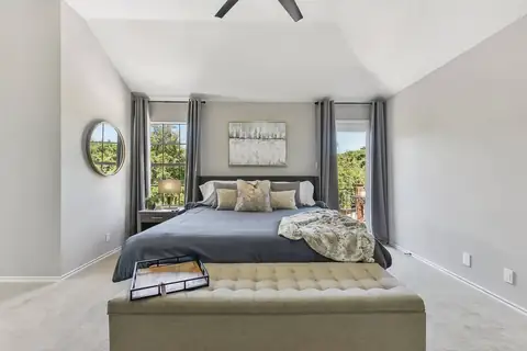 Primary 1- Through french doors, subdued modern hues provide a feeling of tranquility and luxury welcoming you to a peaceful respite, ensuite bathroom, 55"…