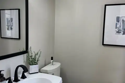 Downstairs powder room, right off entry foyer