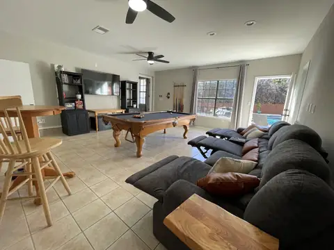 Pool room is perfect for movie night on "heated" and massage reclining sectional watching on 65" Roku Smart Tv, or stream your favorite sport while playing…