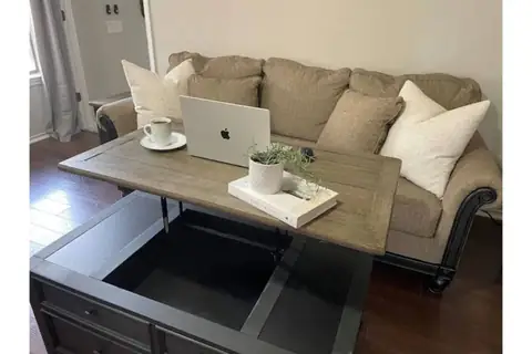 Fun feature-The downstairs coffee table actually lifts up for a cool convenient additional workspace!