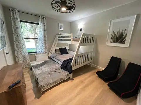 3rd bedroom features FULL size bunk bed, TWIN up top, pull out TWIN trundle bed. Dimmable Wall lamp for late night reading has it's own power & USB ports…