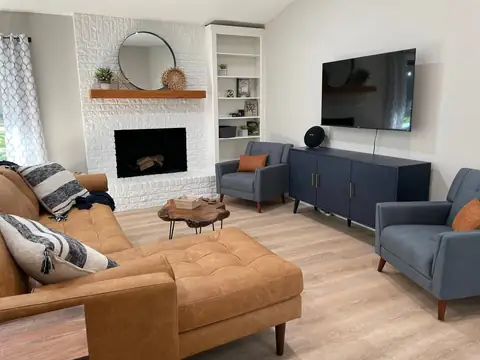 Open living room with Fireplace, 55" Smart TV preloaded with Roku, Netflix and Spectrum cable tv!